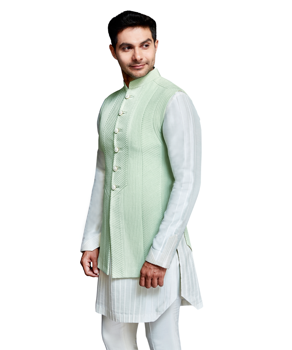 Mint panelled quilted bandi with ivory silk pleated kurta and ivory silk pants