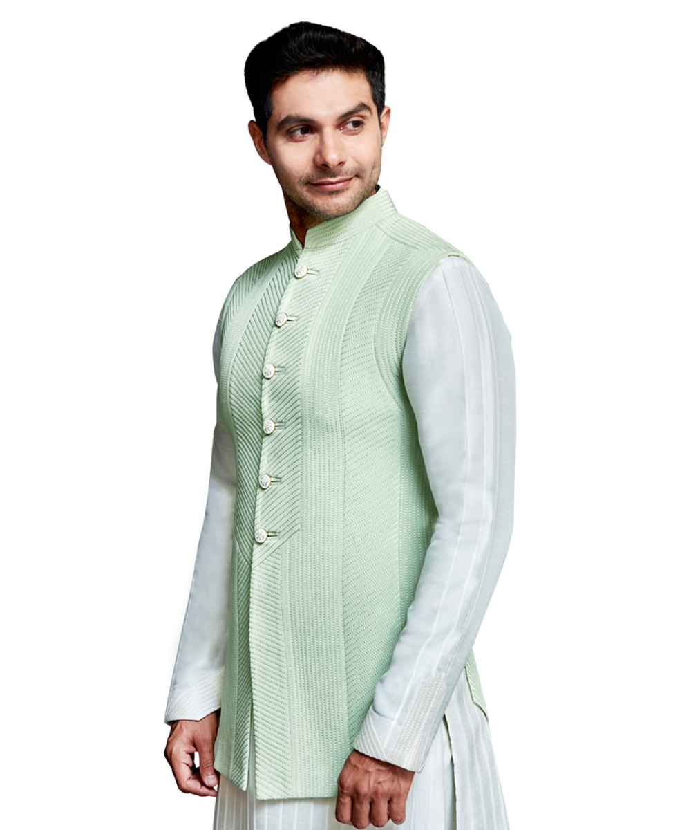 Mint panelled quilted bandi with ivory silk pleated kurta and ivory silk pants